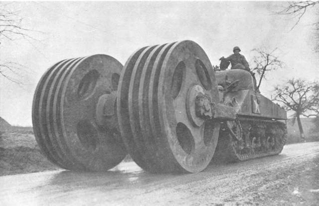 The two large wheels mounted in front of this tank are designed to clear safe path for the tank through the enemy mines.