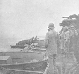 A tank waits on a section of a pontoon bridge built by combat engineers of the 90th Division as a ferry to cross the Saar River.