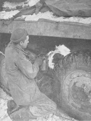A blowtorch being used to thaw the brake parts on vehicle in the extreme cold in Belgium.